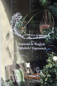 Shopfront of Restaurant De Waaghals, a vegetarian and vegan fine dining restaurant in De Pijp, Amsterdam.